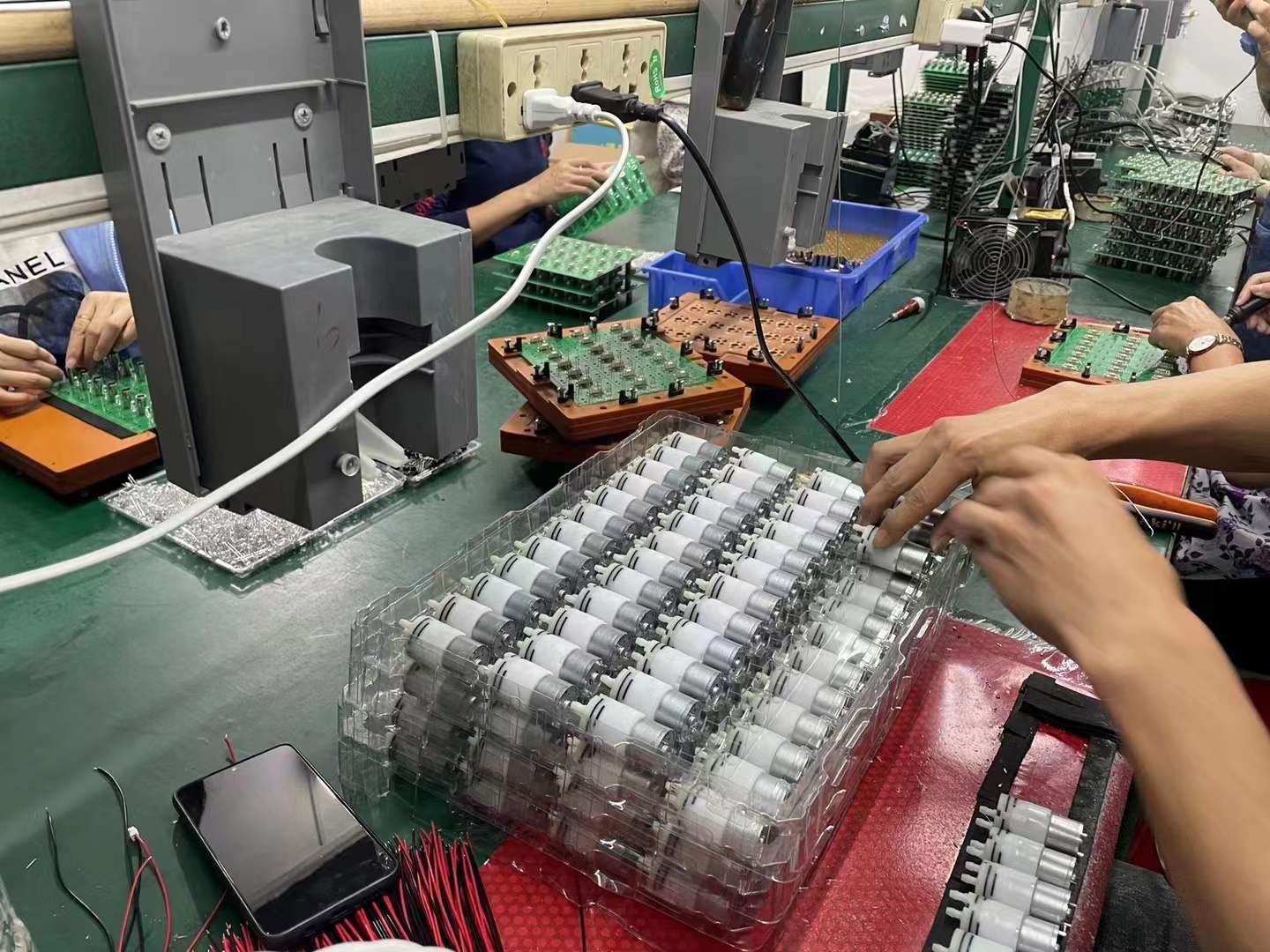 Production line for touchless dispensers